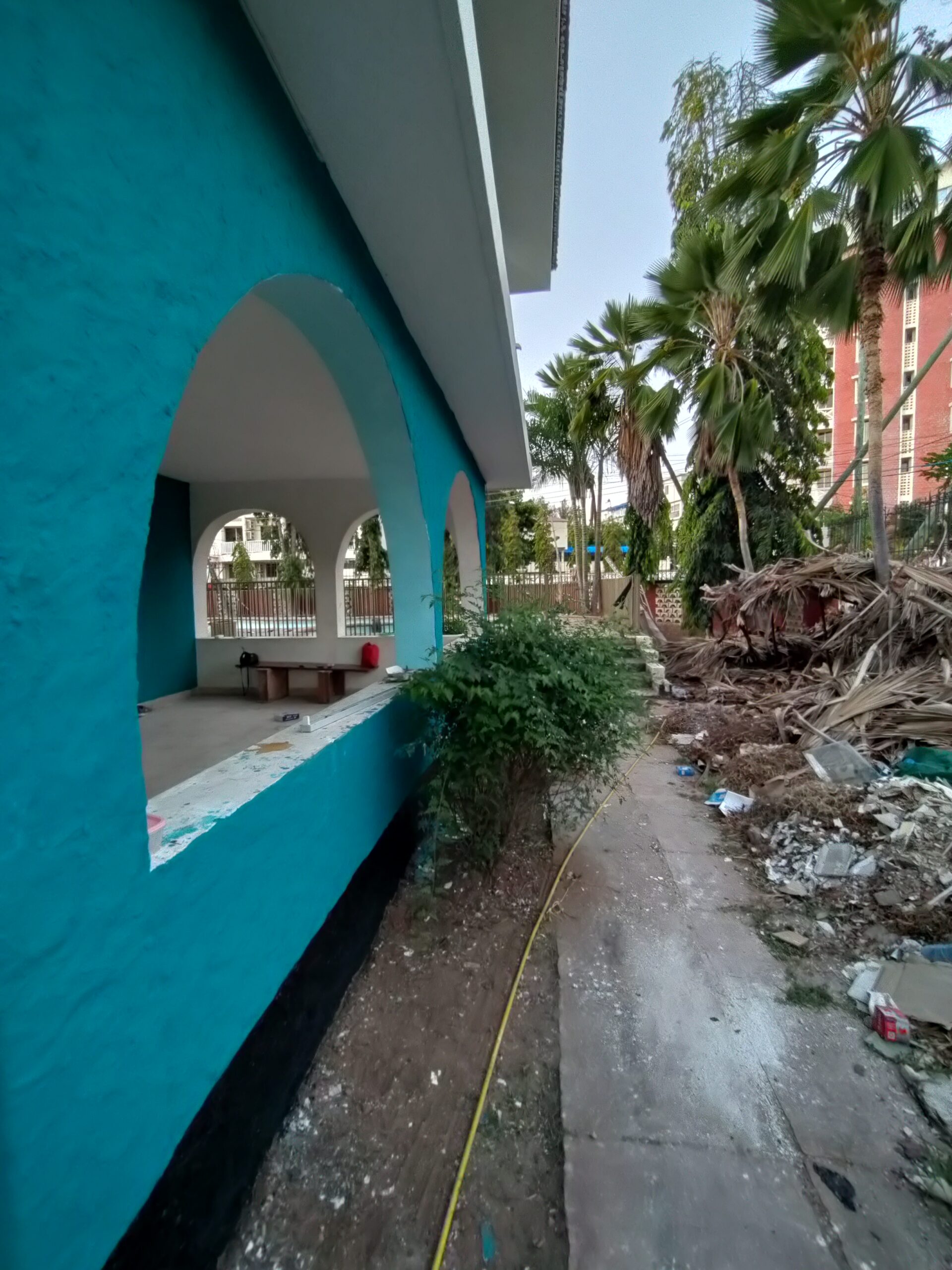 An exterior corridor at Gallivanters Hostel during the renovation phase
