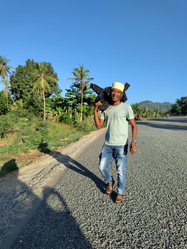 Kibwana walking along a quiet road in Tanzania’s Tanga Region