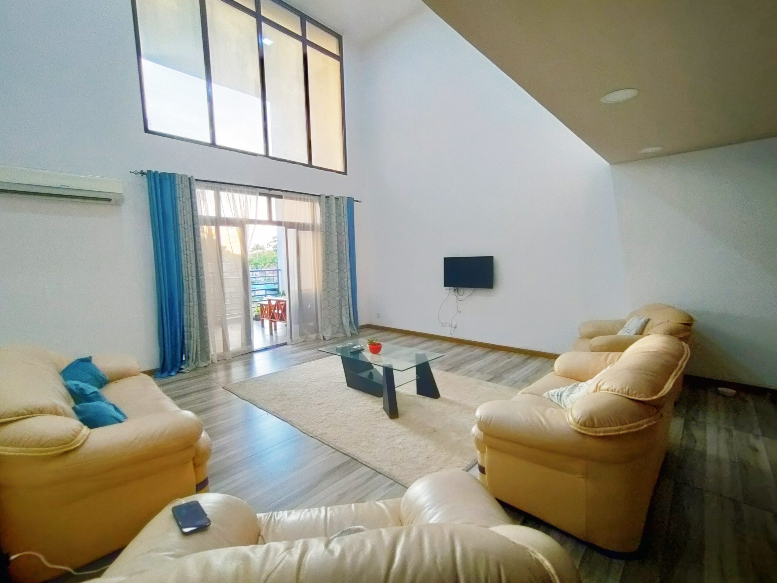 A bright shared living space in the Mikocheni Airbnb apartment