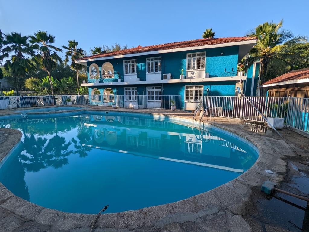 The swimming pool and blue two-storey building at the former Gallivanters Hostel in Masaki.