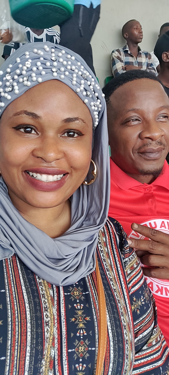 Tamara and Kibwana attending a Simba football match at the stadium.
